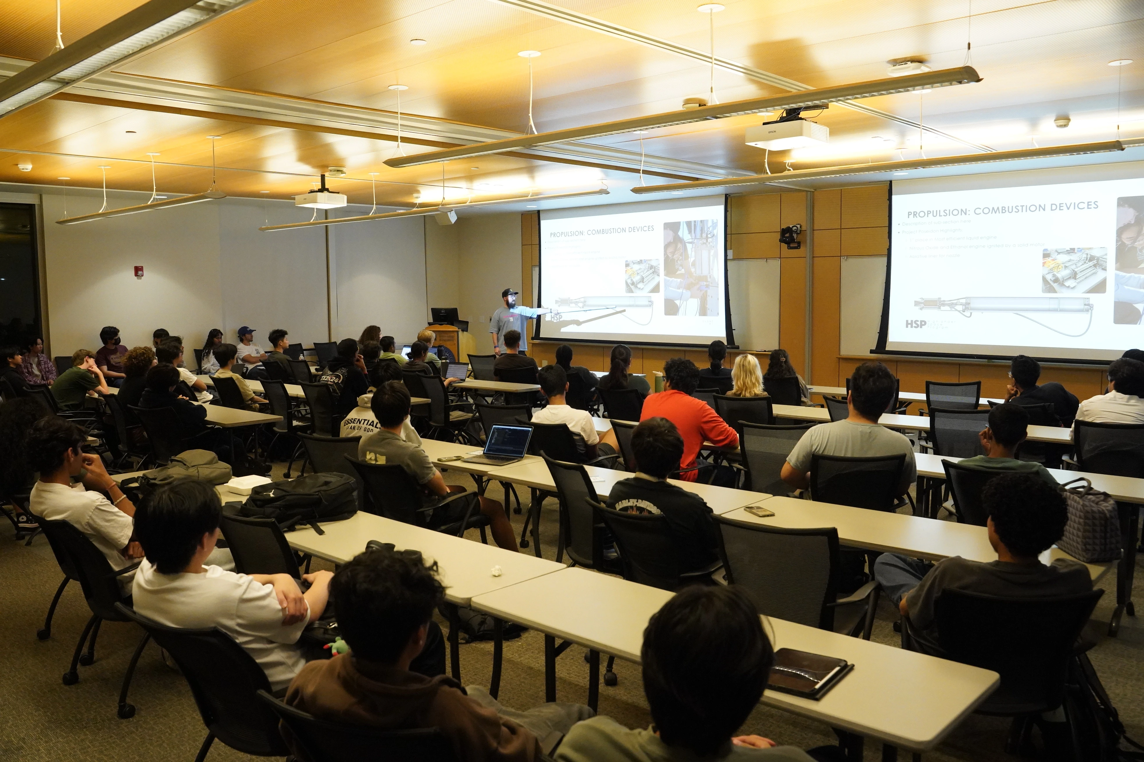 Students attending a presentation in a lecture hall