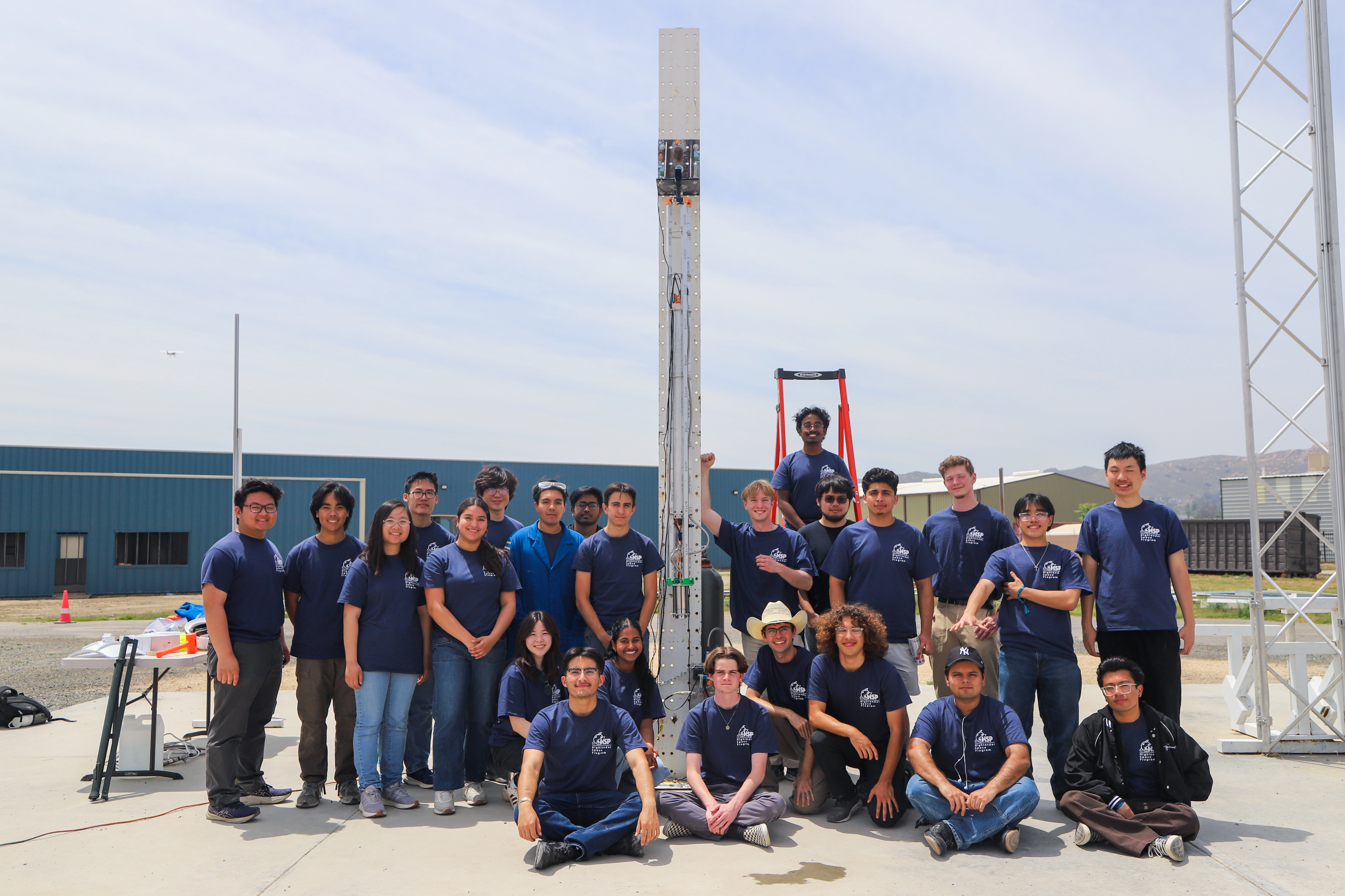HSP members standing with their rocket at the launch site
